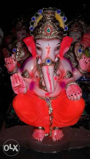 Red And Multicolored Lord Ganesha Figurine