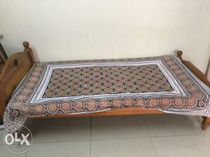 Single bed with comfortable cotton mattress.
