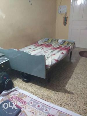 Wooden bed with cotton mattress. Size 4ft X 6.25ft