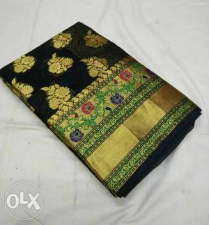 Yellow, Green, And Black Floral Textile