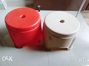 A set of red and weige stools is available for sale