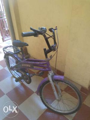 Purple And Black Bicycle With Training Wheels