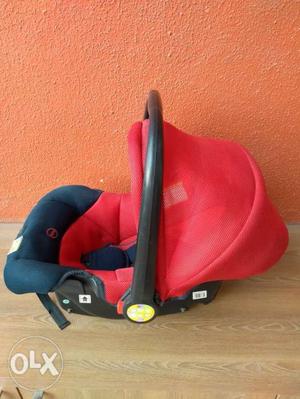 Baby's Red And Blue Car Seat Carrier