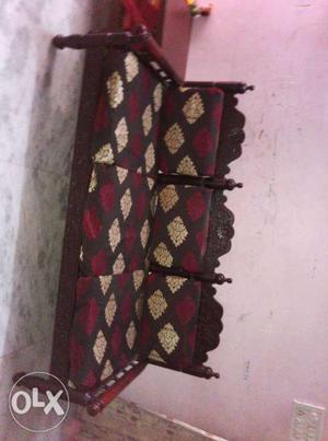 Black And Maroon Couch With Brown Wooden Frame