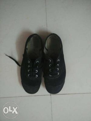 Black Canvas school shoes (size 6), costing Rs.