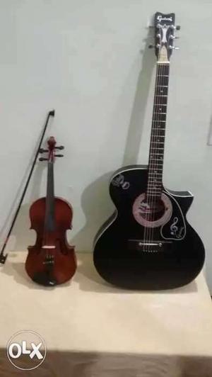 Black Cutaway Acoustic Guitar And Violin