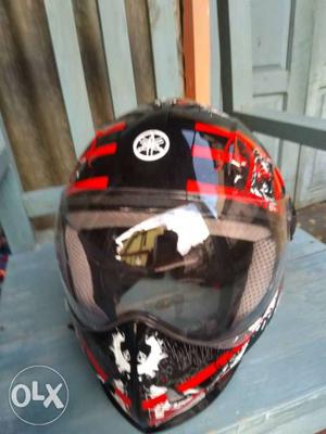 Black, Red, And White Yamaha Full-face Helmet