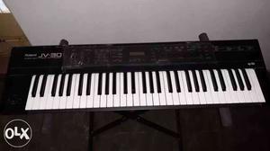 Black Roland JV-30 Electronic Keyboard with stand & Adaptor.
