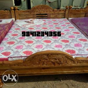 Brown Wooden Bed And White Floral Mattress With 