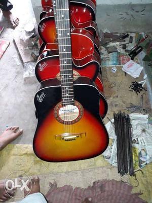 Red Dreadnought And Cutaway Acoustic Guitars