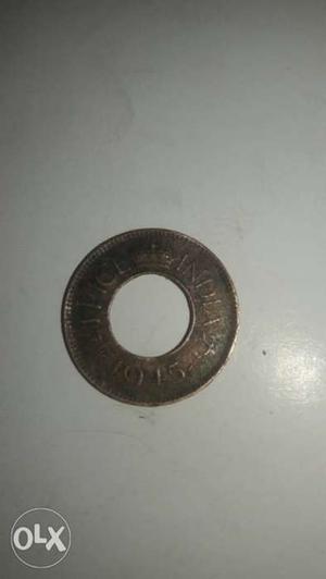Round  Bronze-colored 1 Indian Paisa Coin