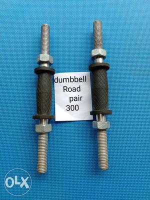 Two Gray Dumbbell Poles
