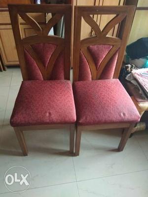 Two Red Padded Brown Wooden Chairs