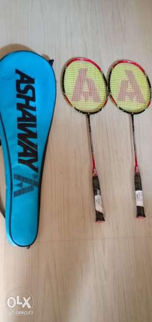 Two Yellow Ashwat Badminton Rackets With Case