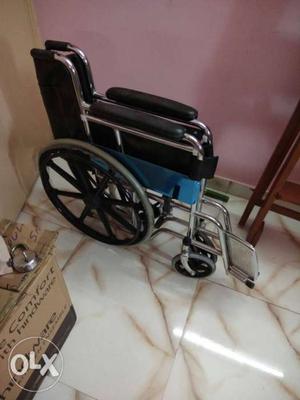Black And Blue Folding Wheelchair