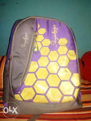 Black, Purple, And Yellow Backpack