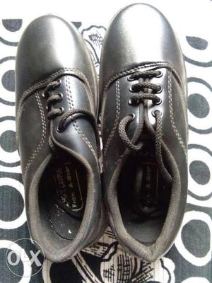 Black unused school shoe 4 number for boy.