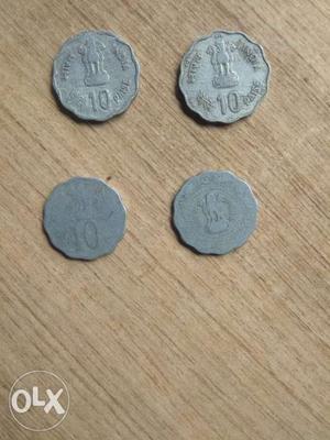 Four Scallop Edged Silver-colored Indian Paise Coins