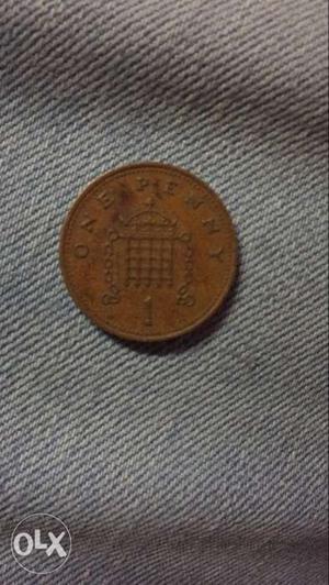 Round Copper-colored One Penny Coin