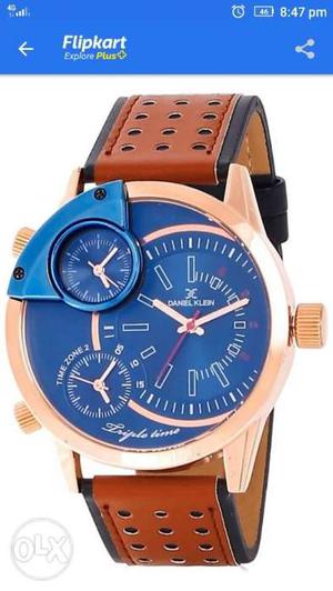 Round Gold-colored Chronograph Watch With Blue Leather Strap