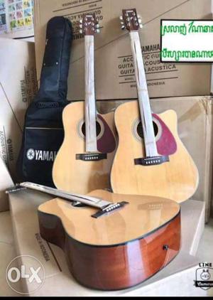 Three Beige Yamaha Cutaway Acoustic Guitars With Gig Bag