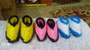 Two Pairs Of Yellow And Blue Knitted Shoes