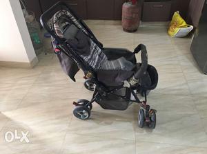 Baby's Black And Gray Stroller