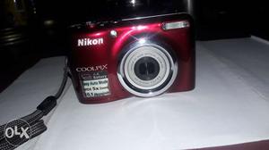 Brand new red NIKON COOLPIX L23 with accessories