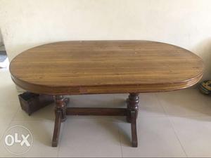Brown wooden dining table with 3chairs