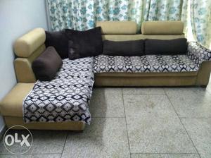 L shape sofa. Light shade of brown colour. And