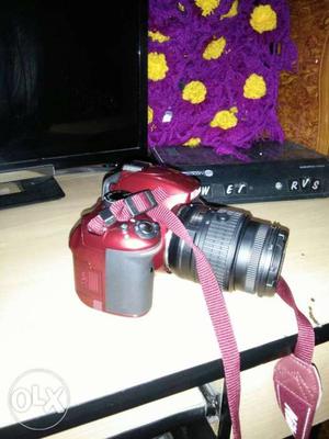 Red And Black DSLR Camera