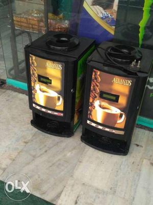 Two Black And Brown coffee Machines