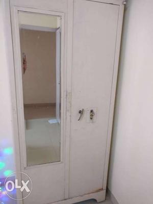White Godrej Cupboard with mirror and locker.