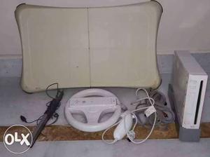 White Nintendo Wii With Balance Pad And Controllers