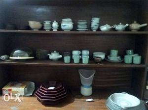 Wooden cabinet with crockery. Senior citizen