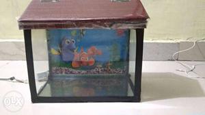 1 feet fish tank with roof. Not leaking. Price