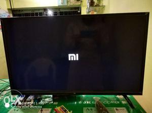 Black MI Flat Screen TV