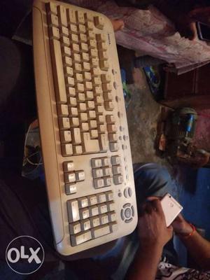 White And Gray Corded Computer Keyboard
