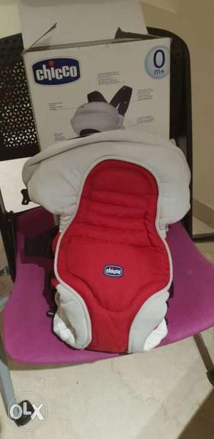 Baby's Red And White Chicco Car Seat Carrier