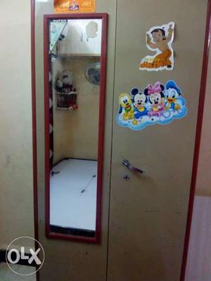 Beige And Red Closet With Mirror