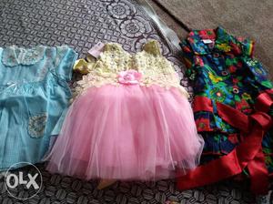 Brand new. Set of 3 dresses for 1 year old