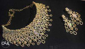 Custom made stone embellished gold coloured necklace with