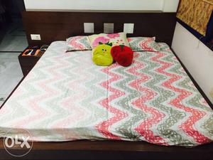 Double bed with side table, mattress and under storage