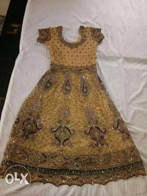 Gold color,floor length anarkali in net with