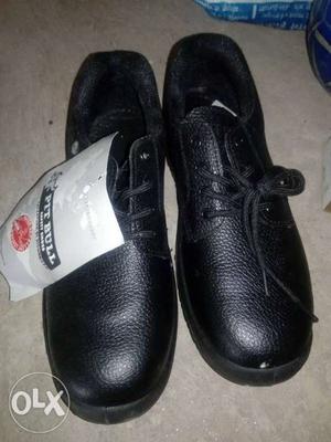 Pair Of Black Leather safety Shoes