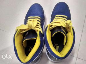 Pair Of Blue-and-yellow Puma Sneakers