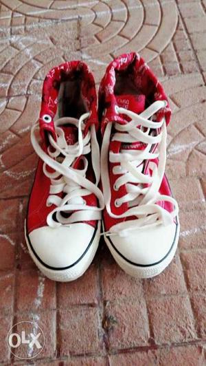 Pair Of Red Converse All Star High-top Sneakers