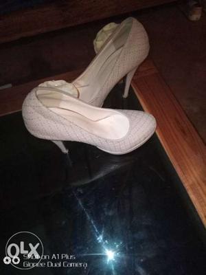 Pair Of White Leather Heeled Shoes