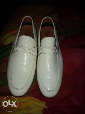 Pair of white branded loafers for boys