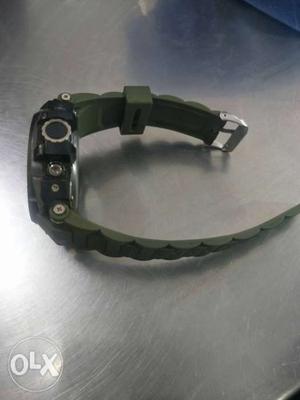 Round Black Watch With Green Strap
